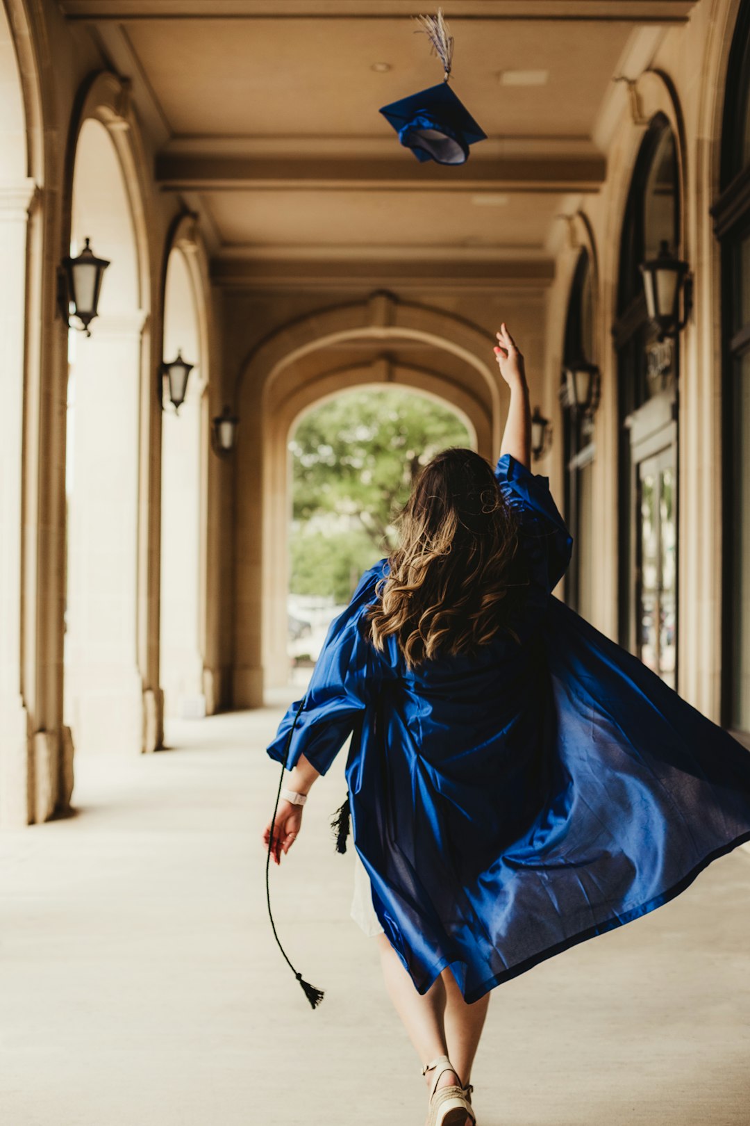 woman-in-blue-dress-walking-on-hallway-l5samraow9g